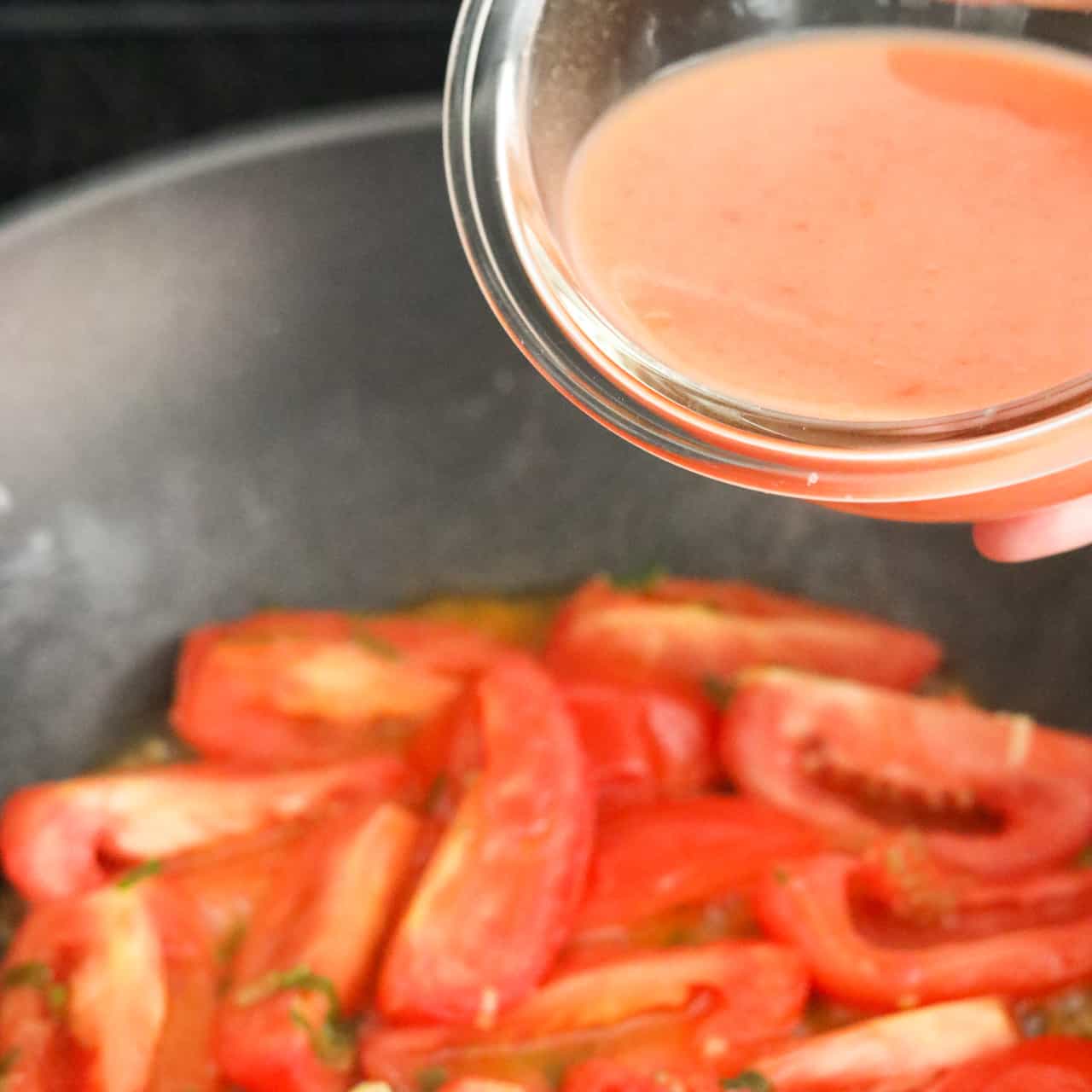 Pour sauce over tomatoes